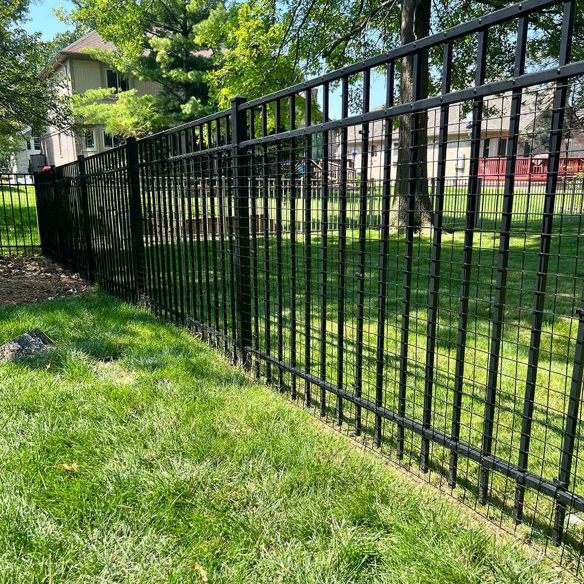 42-inch tall dog barrier panel designed to prevent pets from passing through existing fencing, by Dog Proofer.