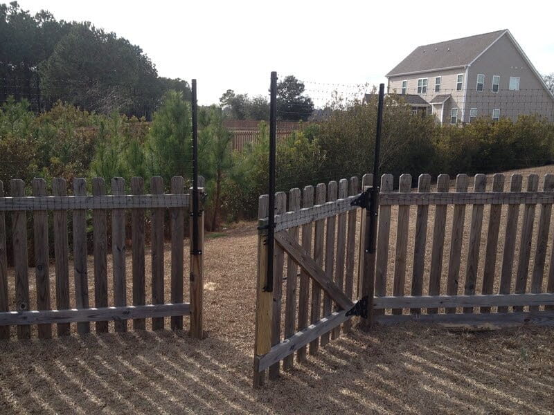 Dog Fence Height Extension Installed on Existing Wood Fence by Dog Proofer 