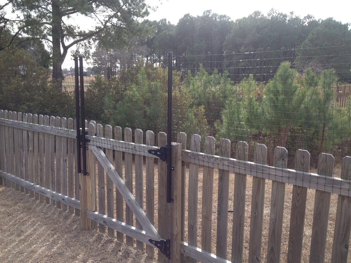 Dog Fence Height Extension installed on Existing Wood Fence and Gate by Dog Proofer 