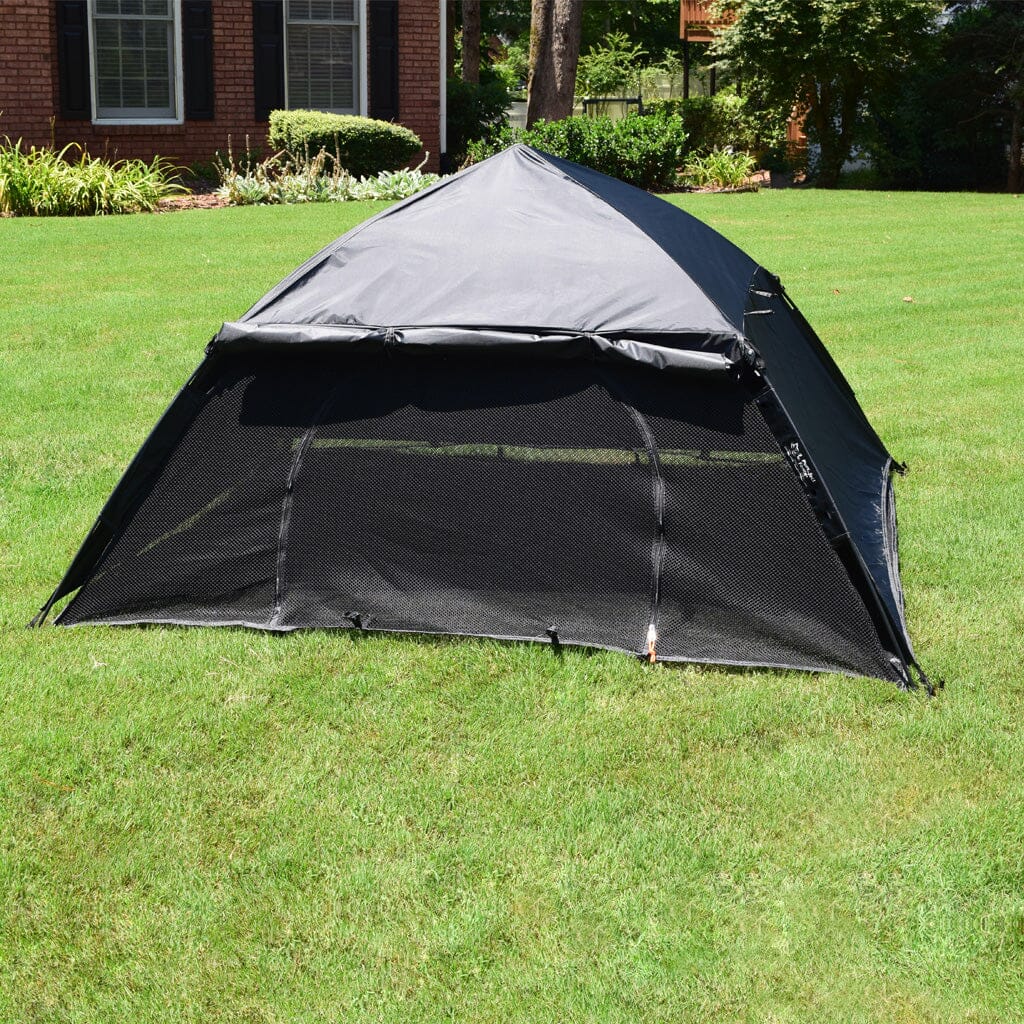 Portable outdoor cat tent by Dog Proofer, compact and secure shelter for pets in an outdoor setting.