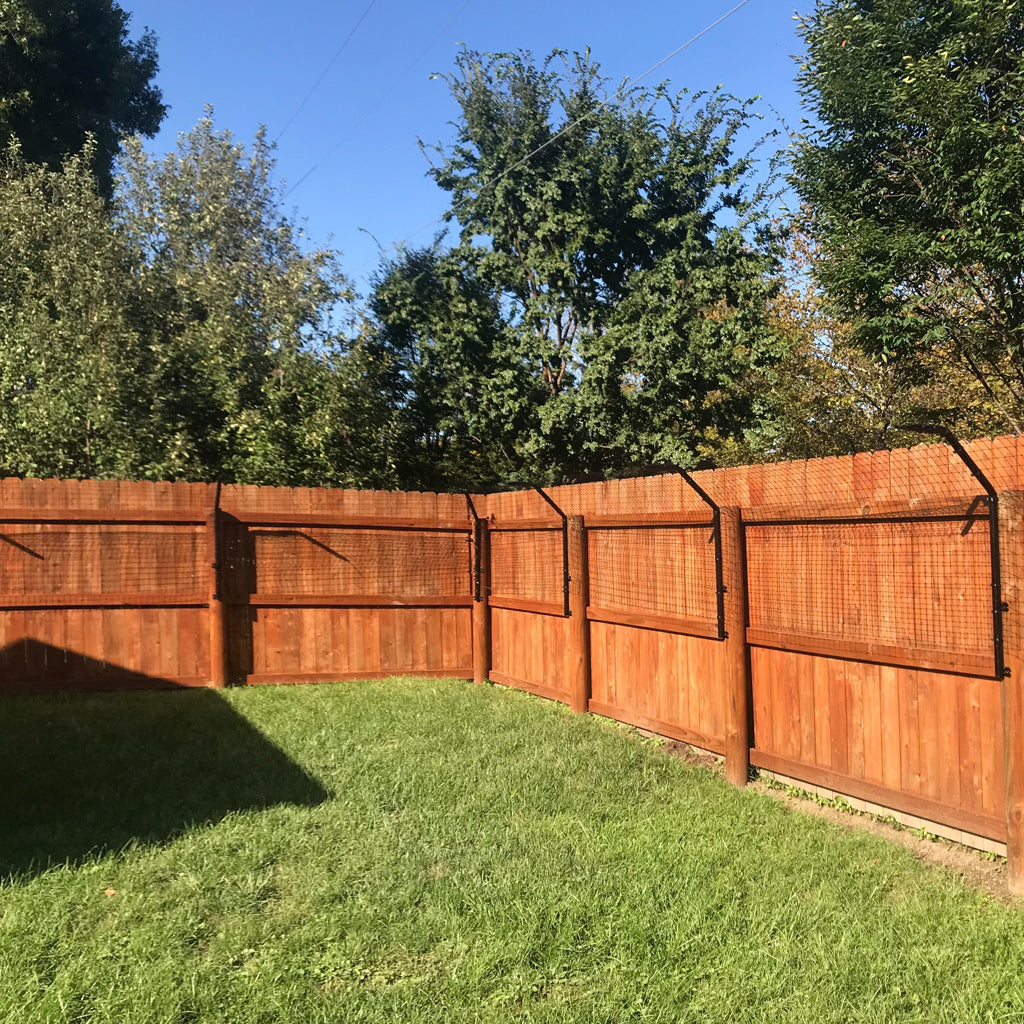 Dog Proofer fence extension kit designed to add height to existing fences for pet safety.